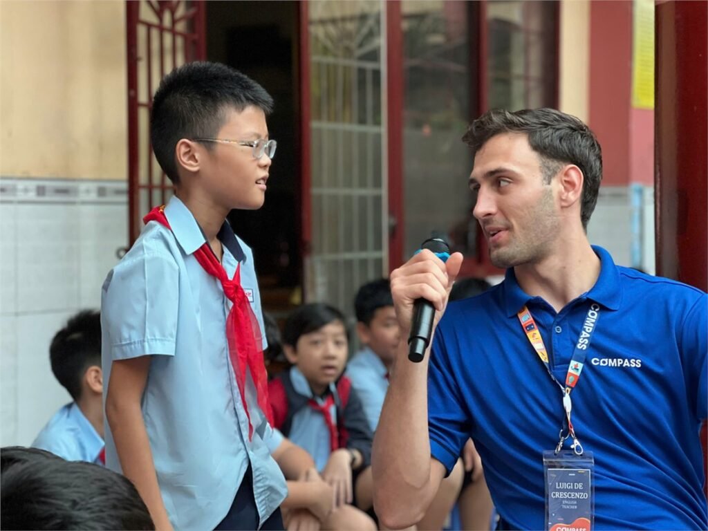 Luigi teaching a student at a school in Vietnam